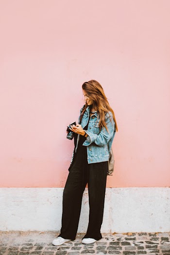 Photo of Woman Holding Camera
