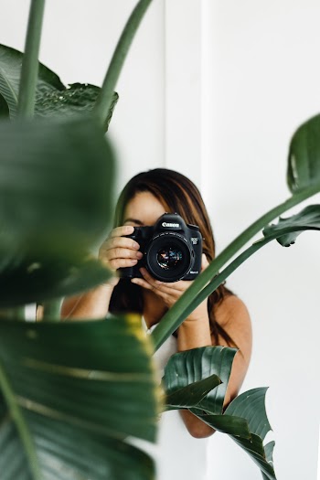 Photo of Woman Holding Camera