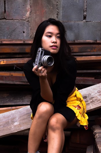 Photo of Woman Holding Camera