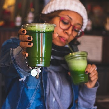 Photo of Woman Holding Clear Plastic Cup