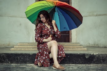 Photo Of Woman Holding Colorful Umbrella