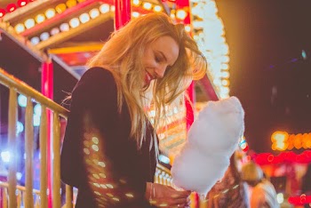 Photo of Woman Holding Cotton Candy