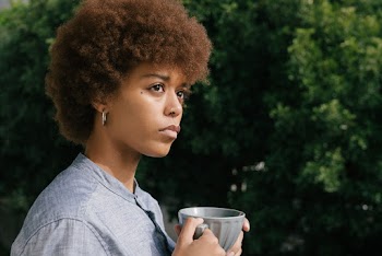 Photo Of Woman Holding Cup