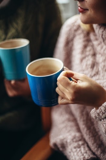 Photo of Woman Holding Cup Of Coffee