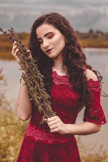 Photo Of Woman Holding Dried Plant