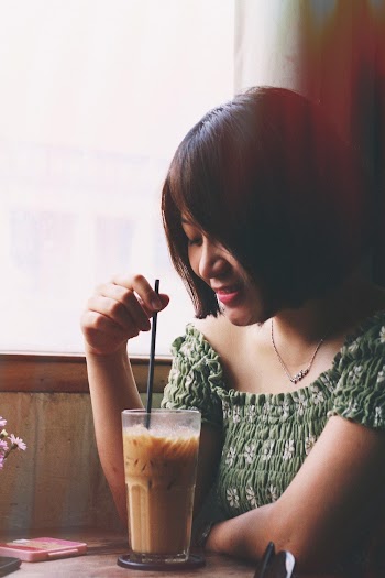 Photo of Woman Holding Drinking Straw 