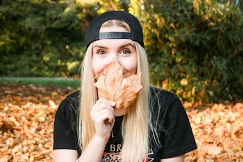 Photo of Woman Holding Dry Leaf