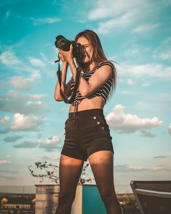Photo of Woman Holding Dslr Camera