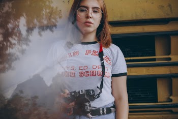 Photo of Woman Holding Dslr Camera