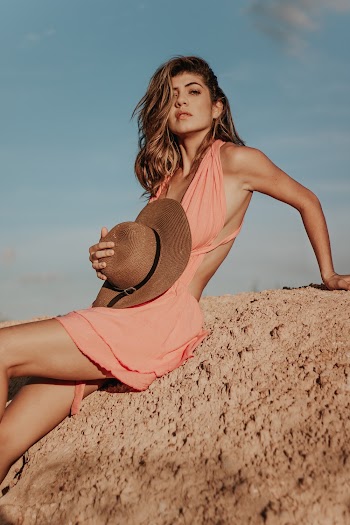 Photo of Woman Holding Fedora