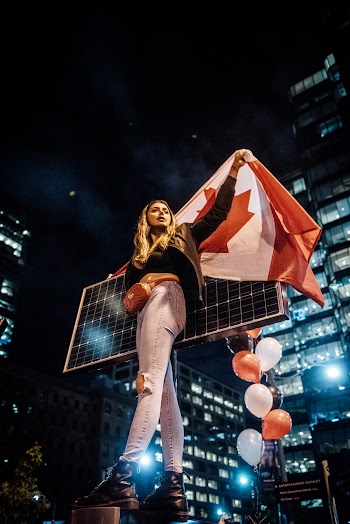 Photo Of Woman Holding Flag