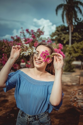 Photo Of Woman Holding Flower