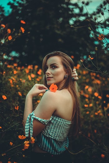 Photo Of Woman Holding Flower
