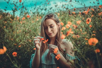 Photo Of Woman Holding Flower
