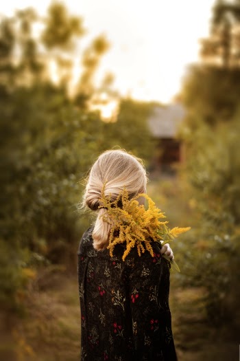 Photo Of Woman Holding Flower