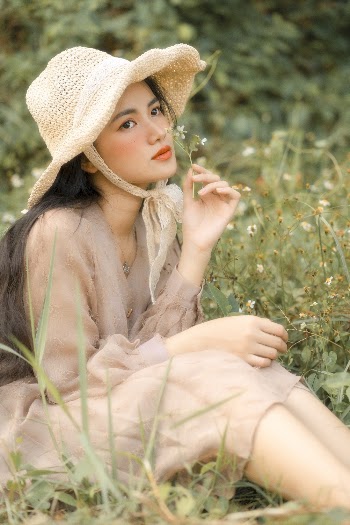 Photo of Woman Holding Flower