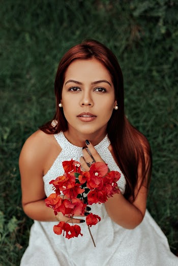 Photo Of Woman Holding Flowers