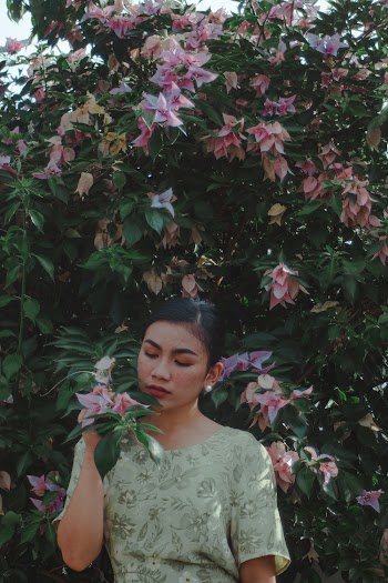 Photo Of Woman Holding Flowers