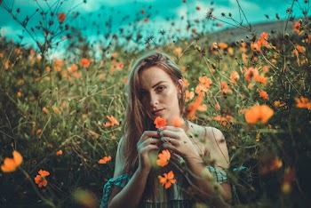 Photo Of Woman Holding Flowers