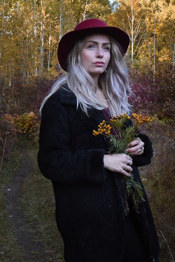 Photo Of Woman Holding Flowers