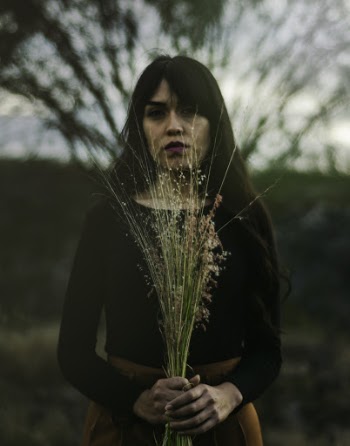 Photo Of Woman Holding Flowers 