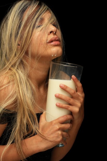 Photo of Woman Holding Glass of Milk