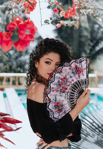 Photo Of Woman Holding Hand Fan