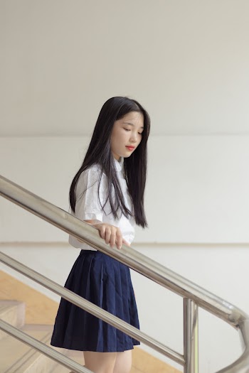 Photo Of Woman Holding Handrail