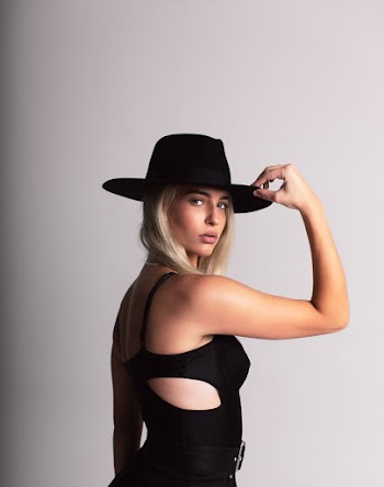 Photo Of Woman Holding Hat
