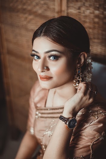 Photo Of Woman Holding Her Earing