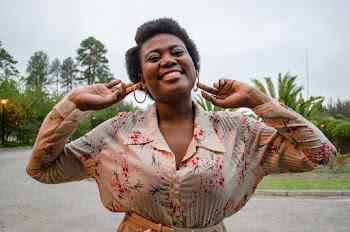 Photo Of Woman Holding Her Earings