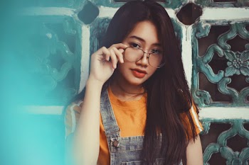 Photo of Woman Holding Her Eyeglasses