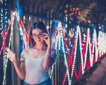 Photo of Woman Holding Her Eyeglasses