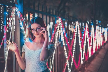 Photo of Woman Holding Her Eyeglasses
