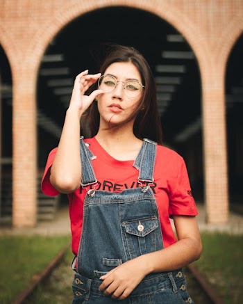 Photo of Woman Holding Her Eyeglasses