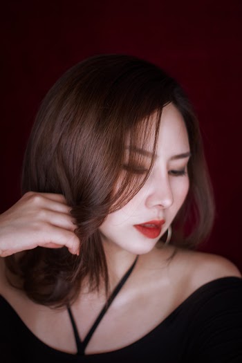 Photo Of Woman Holding Her Hair