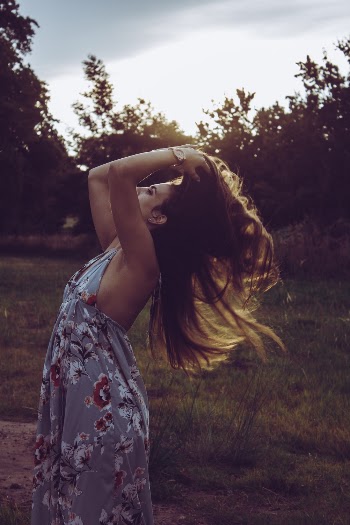 Photo of Woman Holding Her Hair
