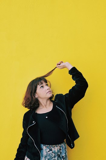 Photo of Woman Holding Her Hair