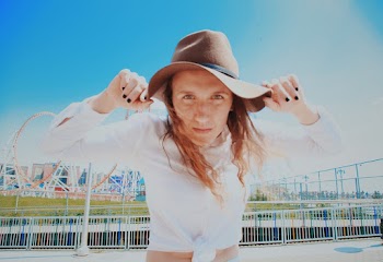 Photo Of Woman Holding Her Hat