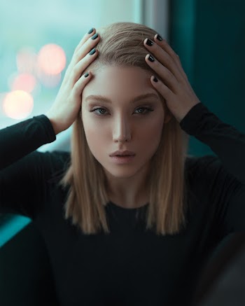 Photo of Woman Holding Her Head
