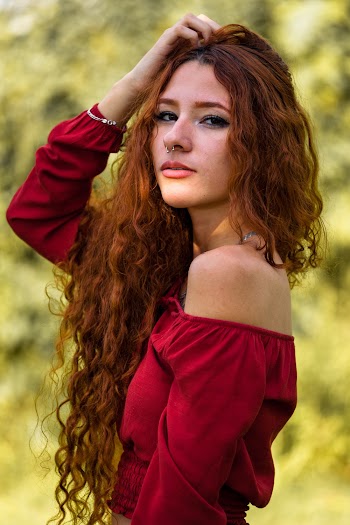 Photo Of Woman Holding Her Head