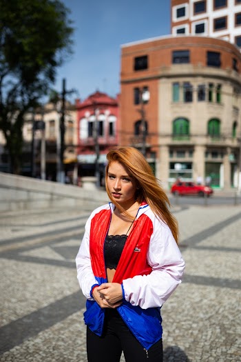 Photo of Woman Holding Her Jacket