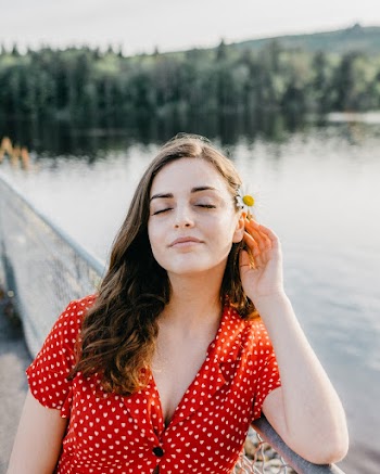 Photo of Woman Holding Her Left Ear