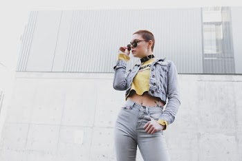 Photo of Woman Holding Her Sunglasses