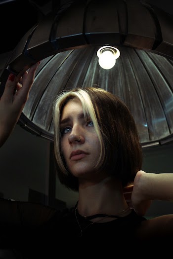 Photo Of Woman Holding Lamp