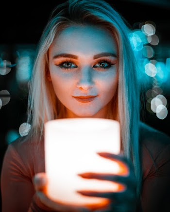 Photo Of Woman Holding Lamp