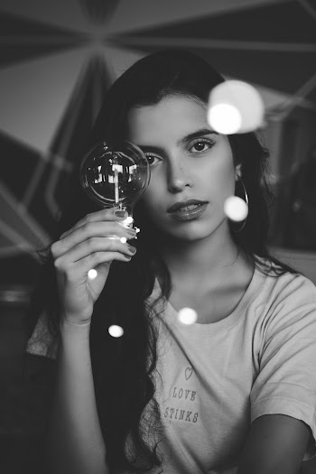 Photo of Woman Holding Light Bulb