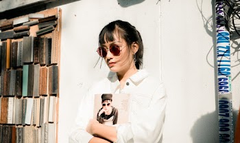 Photo Of Woman Holding Magazine