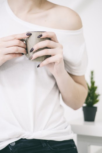 Photo of Woman Holding Mug