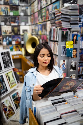 Photo of Woman Holding Phonograph Record